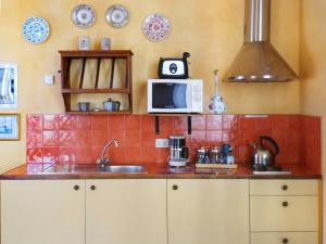 A kitchen or kitchenette at Poggio Imperiale Apartments