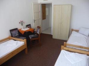 Postel nebo postele na pokoji v ubytování Vila Diakonia
