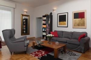 a living room with a couch and a table at B&B Al Parco Giardini Margherita in Bologna