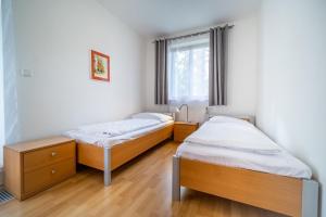 Llit o llits en una habitació de Apartment Riviera 503-7 Lipno Home