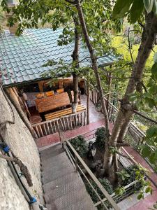 an overhead view of a house with a bench and trees at Holiday House in Yerevan with Garden and Lovely Views in Yerevan