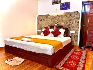 a bedroom with a large bed in a room at LAZY RETREAT in Vagamon
