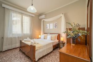 Postel nebo postele na pokoji v ubytování Neat flat in Argostoli seaside Town