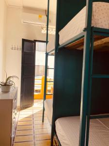 a room with two bunk beds in a room at Hostal 1545 in Ríohacha