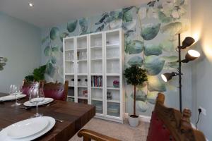 a dining room with a table and a book shelf at Auckland View - a comfy & spacious 4bed with views in Coundon