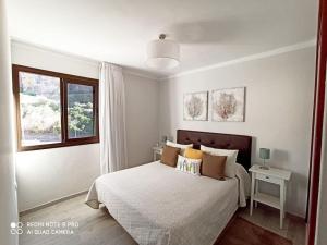 Postel nebo postele na pokoji v ubytování Ventana al Mar