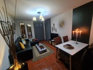 a living room with a couch and a table at apartamento Tita in Tapia de Casariego