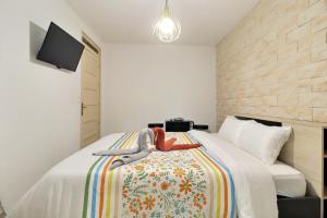 Posteľ alebo postele v izbe v ubytovaní Chambre cosy jo