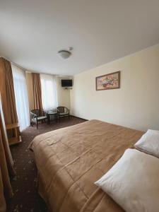 Posteľ alebo postele v izbe v ubytovaní Hotel Zorepad