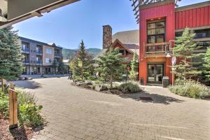 a cobblestone street in front of a red building at Cozy Kellogg Condo - Ski at Silver Mountain Resort in Kellogg