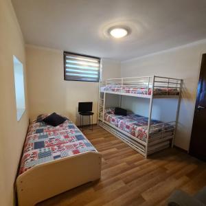 a bedroom with two bunk beds and a desk at Het Blauwe Salamander Huis in Kékesd +28 photos