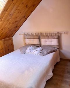 En eller flere senge i et værelse på Appartement Chalet Pra Loup