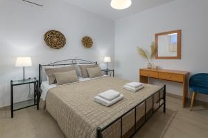 Ένα ή περισσότερα κρεβάτια σε δωμάτιο στο Villa Corinna +31 φωτογραφίες