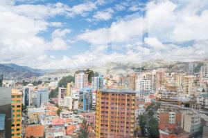 a view of a city with buildings and mountains at Sky Suites - Fantastic Apt in the heart of La Paz in La Paz