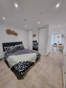 a bedroom with a large bed in a room at Brand New - Massive Studio - E1 - Self Catering in Gibraltar