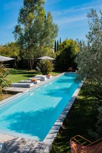 a swimming pool in the yard of a house at Maison Jalon in Aix-en-Provence