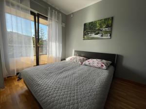 Posteľ alebo postele v izbe v ubytovaní Apartament Słoneczny
