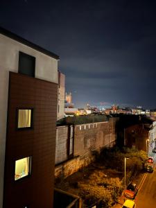 a view of a city at night from a building at Stunning City Centre Apartment, Benson Street, Liverpool 1 in Liverpool