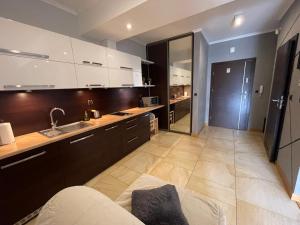 Kuchyňa alebo kuchynka v ubytovaní Apartament Słoneczny