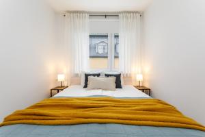 Postel nebo postele na pokoji v ubytování Nikolai apartment