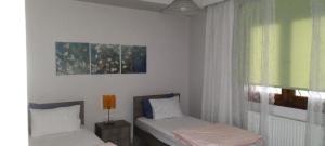 Postel nebo postele na pokoji v ubytování Virginia Apartment