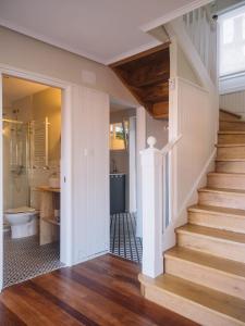 a bathroom with a staircase and a toilet in a house at "Amaluz Ocean Villa" Bilbao Beach para familias y grupos de amigos in Getxo