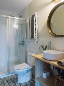 a bathroom with a toilet and a sink and a shower at "Amaluz Ocean Villa" Bilbao Beach para familias y grupos de amigos in Getxo