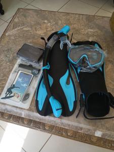 a bag sitting on a table with a cell phone at Desired View in Choiseul