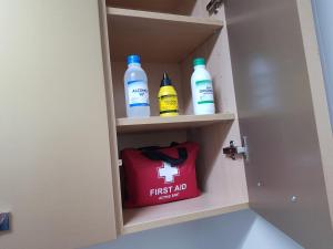 a door with first aid bottles and a red bag at Alojamiento Alcantara in Alora
