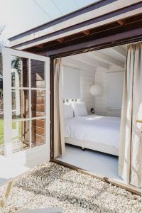 Ένα ή περισσότερα κρεβάτια σε δωμάτιο στο HOLLAND Holiday Home