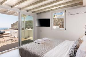 Ένα ή περισσότερα κρεβάτια σε δωμάτιο στο Villa in Mykonos - 6 bedroom - 1km from Mykonos Town - Infinity pool - Sunset view