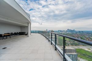 a balcony with a view of a city at Amazing 3 Bed 4 Bath Penthouse with Roof Top Terrace close to Airport in Mississauga