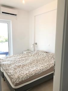 Ένα ή περισσότερα κρεβάτια σε δωμάτιο στο Villa Peony Koroni