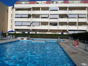 a large swimming pool in front of a building at Studio Flat Vista Mare in Trapani