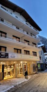 a building with a store in front of it at Alphotel Garni Salner in Ischgl