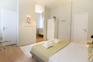 Posteľ alebo postele v izbe v ubytovaní expat renting - Le Barcelone - Compans - Parking