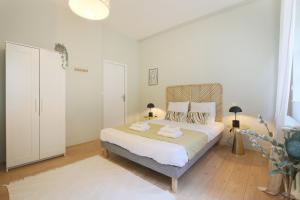Posteľ alebo postele v izbe v ubytovaní expat renting - Le Barcelone - Compans - Parking