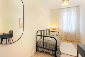 Posteľ alebo postele v izbe v ubytovaní expat renting - Le Barcelone - Compans - Parking
