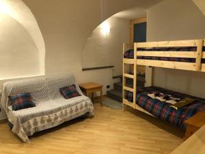 A bed or beds in a room at CASA DIAF appartamento incantevole Carano Ville di Fiemme