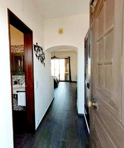 a hallway of a house with a door and a room at Sol Brilhante in Albufeira