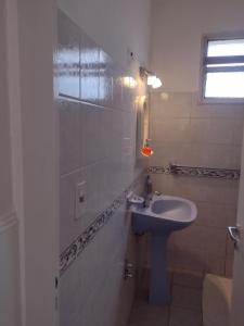 a bathroom with a sink and a mirror at Casa en Santa Rosa in Santa Rosa