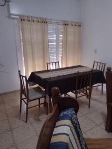 a dining room with a ping pong table and chairs at Casa en Santa Rosa in Santa Rosa