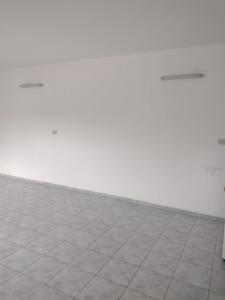 an empty room with a tile floor and white walls at Casa en Santa Rosa in Santa Rosa