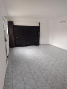 an empty room with a garage with black doors at Casa en Santa Rosa in Santa Rosa