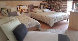 Postel nebo postele na pokoji v ubytování Hameau de Leignoua