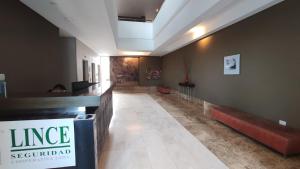 a lobby with a long hallway with a counter and a unintention at Condominios W Nordelta Bahia,Tigre,Parking,Gym in Tigre +31 photos
