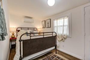 a bedroom with a bed and a window at JT Cottage in Yucca Valley