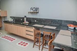 A cozinha ou kitchenette de Suítes 590