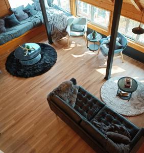 a living room with a couch and a table at Hooting Owl private ski chalet in Niseko