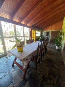 a large dining room with a table and chairs at Lyfrago casa con pileta in San Fernando del Valle de Catamarca